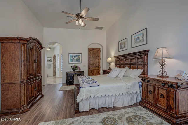 a living room with couch and a potted plant