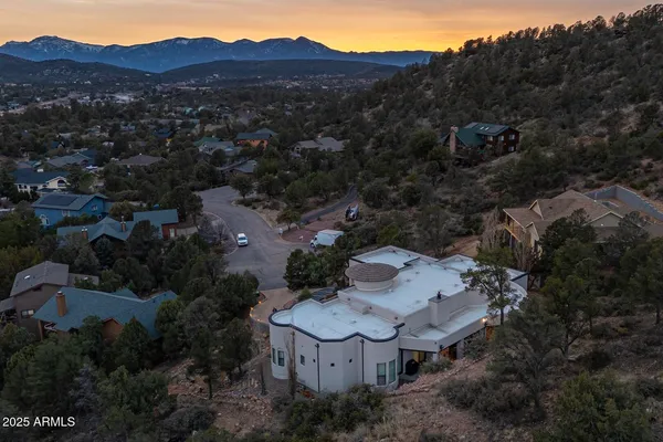 an aerial view of a house with outdoor space and street view