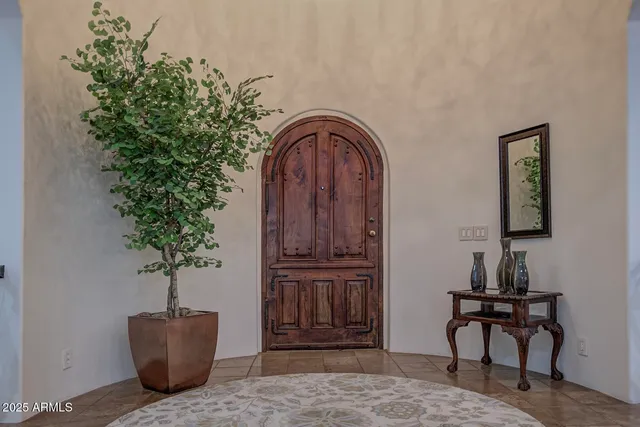 a room with furniture and potted plant