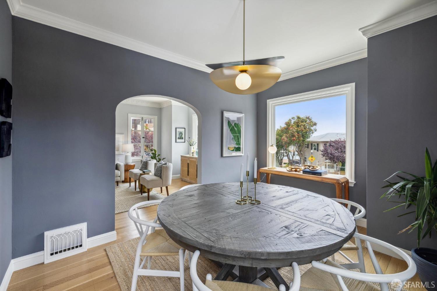 54 Upper Terrace San Francisco, CA 94117 - Photo 11 of 61 a view of a dining room with furniture window and wooden floor