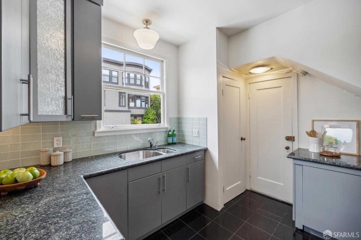 54 Upper Terrace San Francisco, CA 94117 - Photo 18 of 61 a kitchen with a sink and a stove top oven