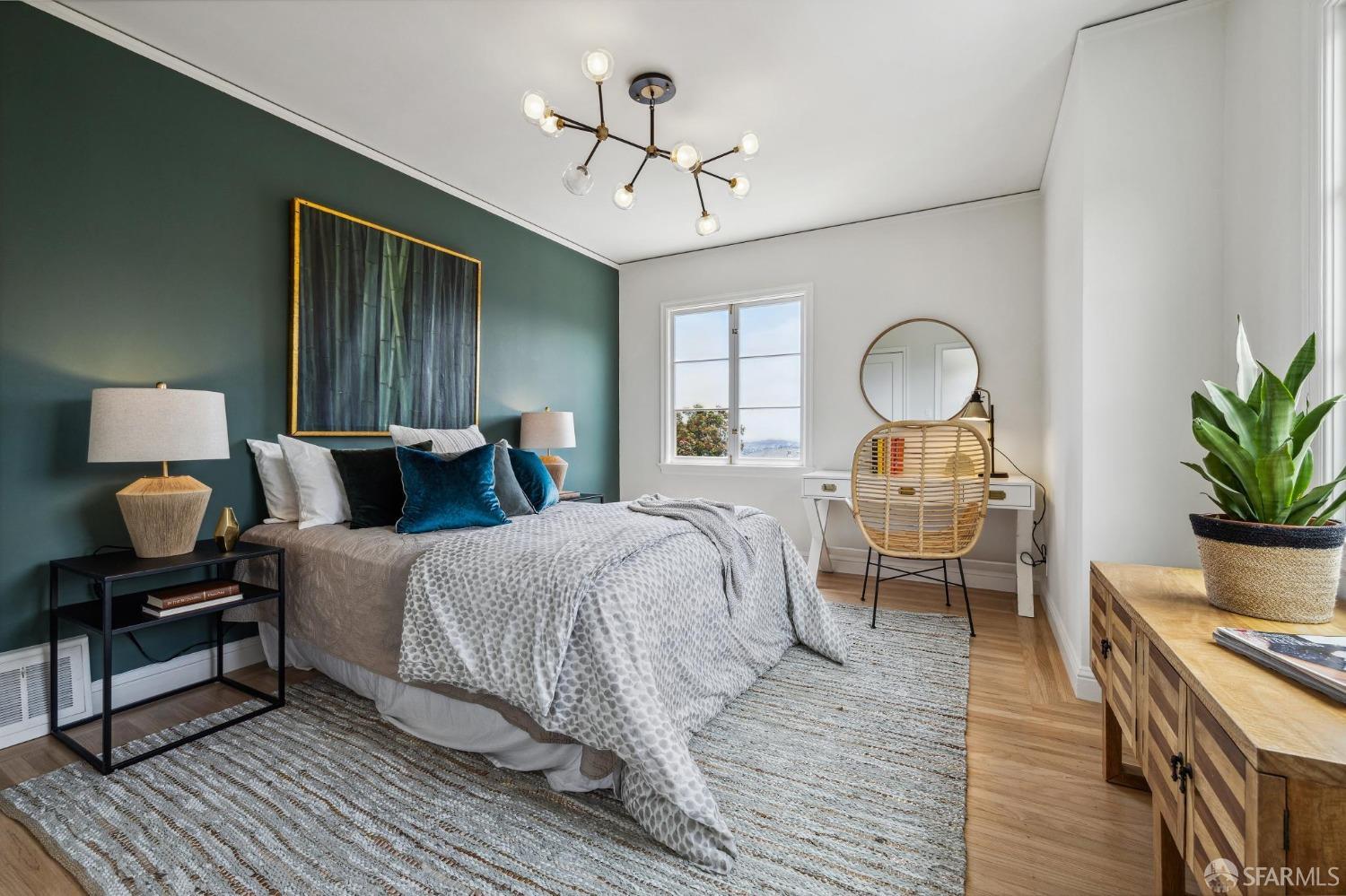 54 Upper Terrace San Francisco, CA 94117 - Photo 23 of 61 a bedroom with a bed and wooden floor