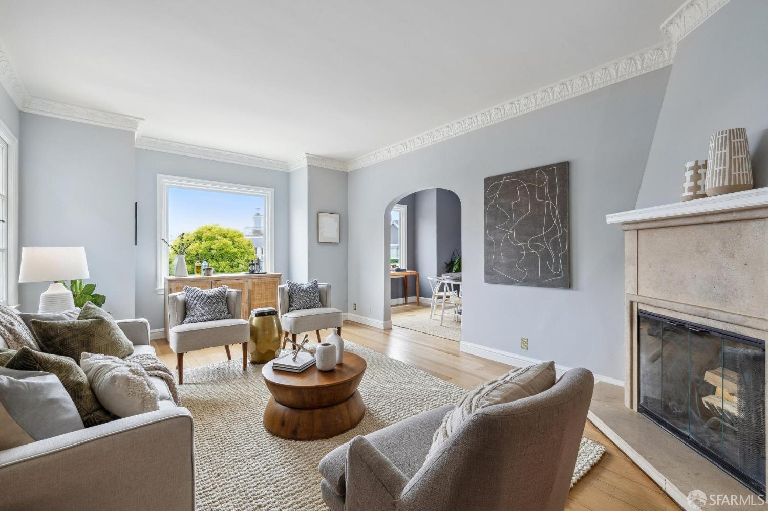54 Upper Terrace San Francisco, CA 94117 - Photo 6 of 61 a living room with furniture and a fireplace