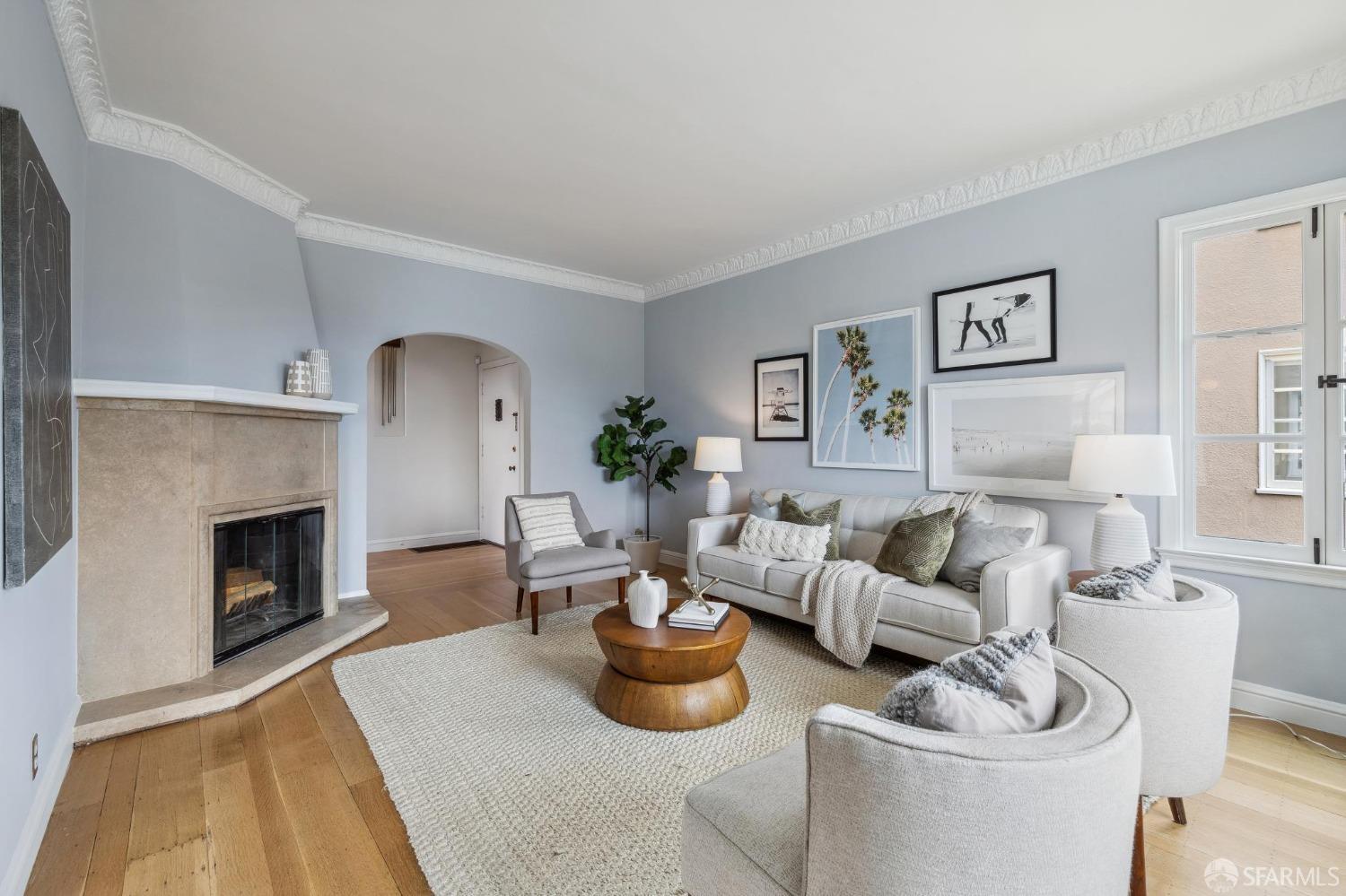54 Upper Terrace San Francisco, CA 94117 - Photo 8 of 61 a living room with furniture potted plant and a fireplace