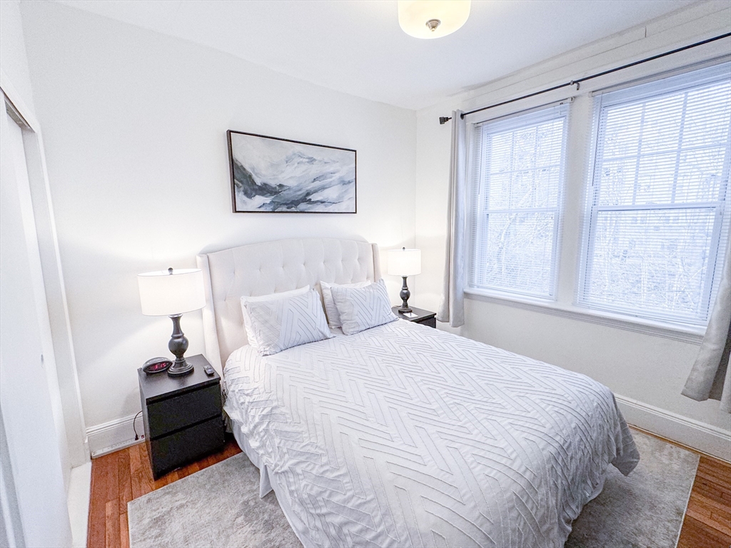 29 Mt Hood Road, Unit 12FURNISHED Boston, MA 02135 - Photo 8 of 11 a bed room with a bed and a window