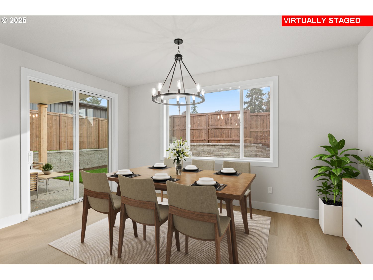 7212 Southwest Windflower Street Wilsonville, OR 97070 - Photo 12 of 28 a dining room with furniture potted plants and wooden floor