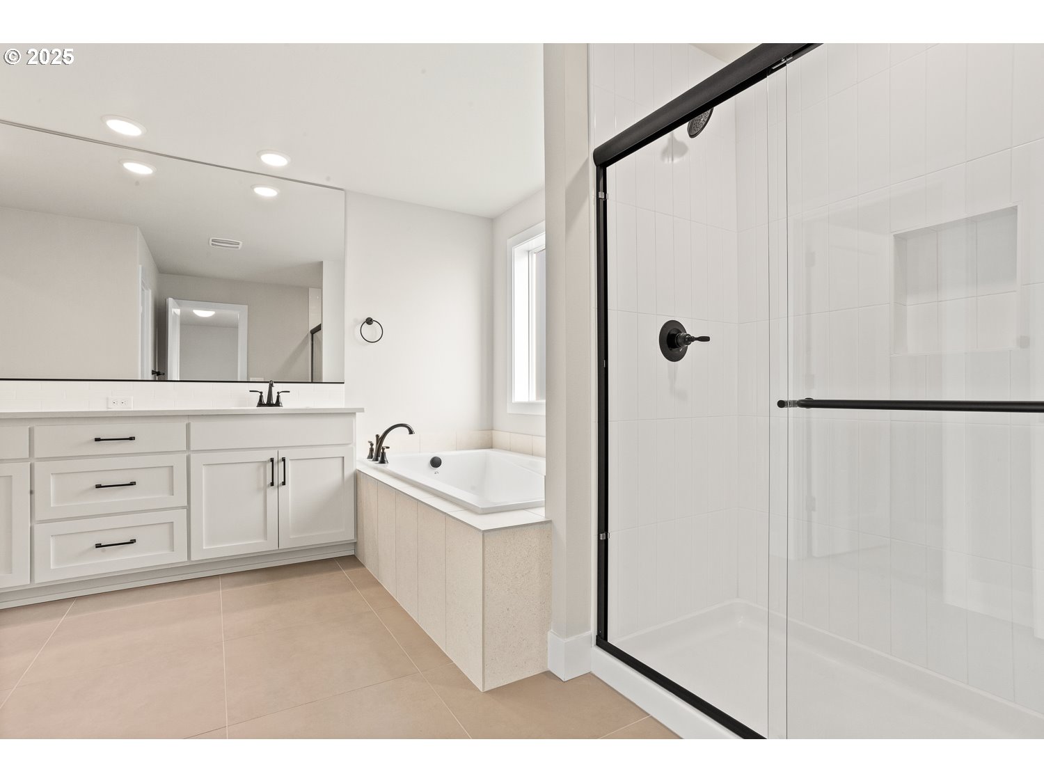 7212 Southwest Windflower Street Wilsonville, OR 97070 - Photo 16 of 28 a large bathroom with a double vanity sink a toilet a shower and a mirror