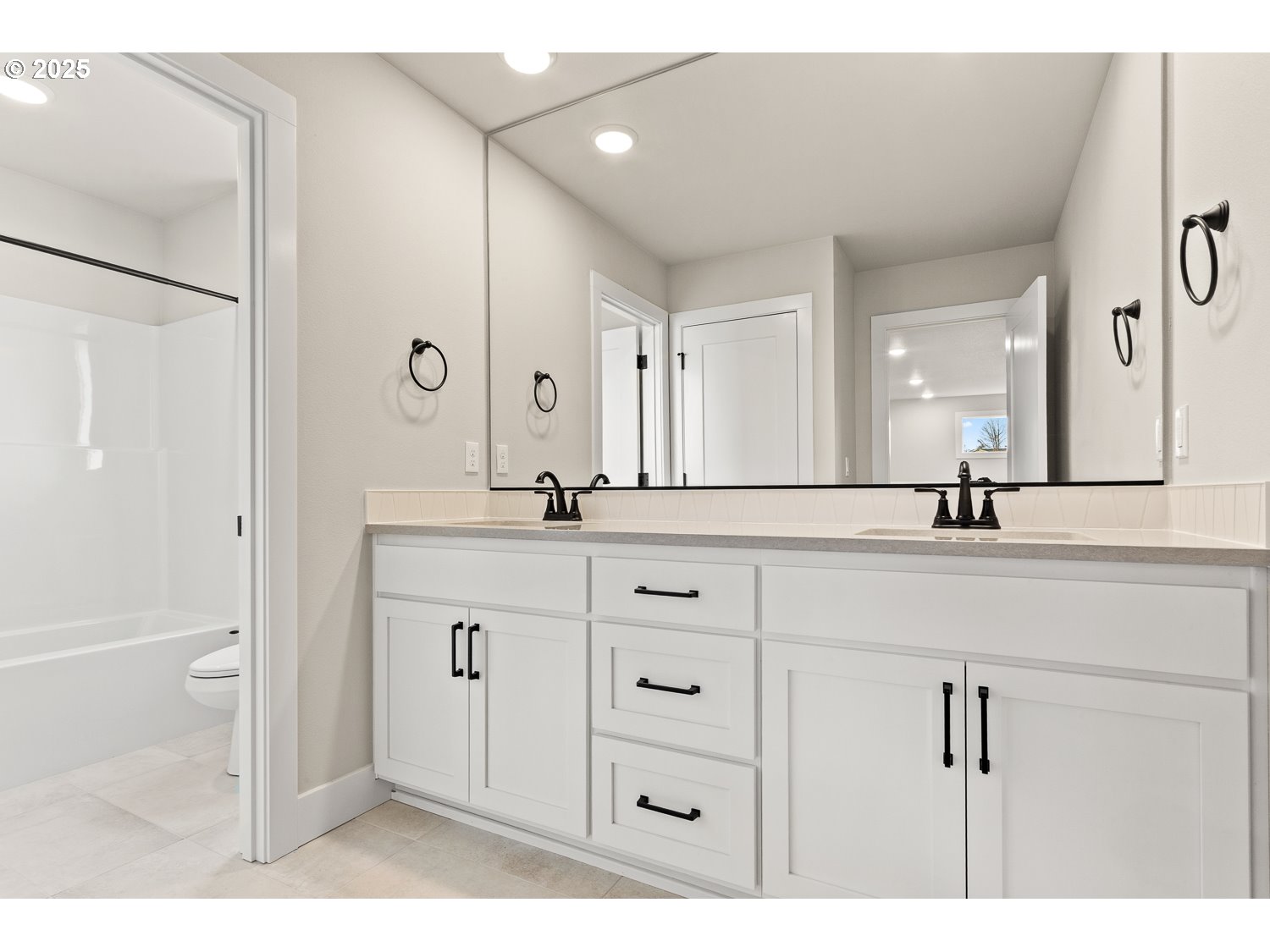 7212 Southwest Windflower Street Wilsonville, OR 97070 - Photo 21 of 28 a bathroom with a double vanity sink and mirror