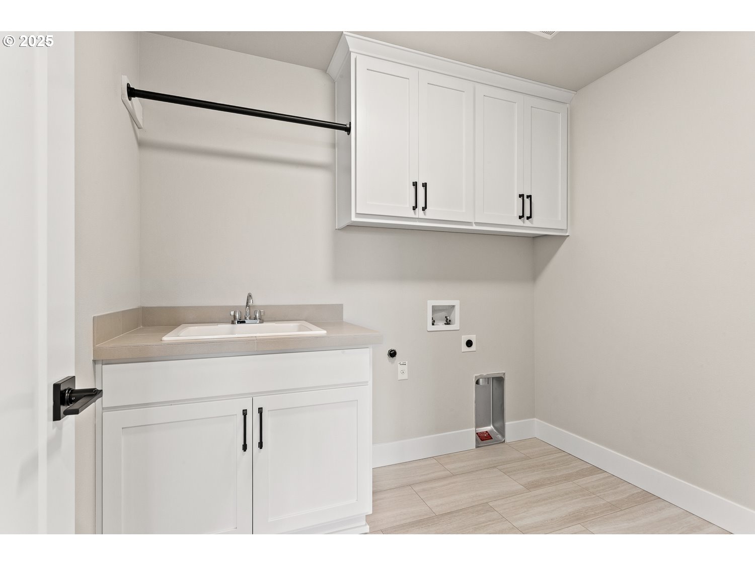 7212 Southwest Windflower Street Wilsonville, OR 97070 - Photo 22 of 28 a kitchen with a sink and cabinets