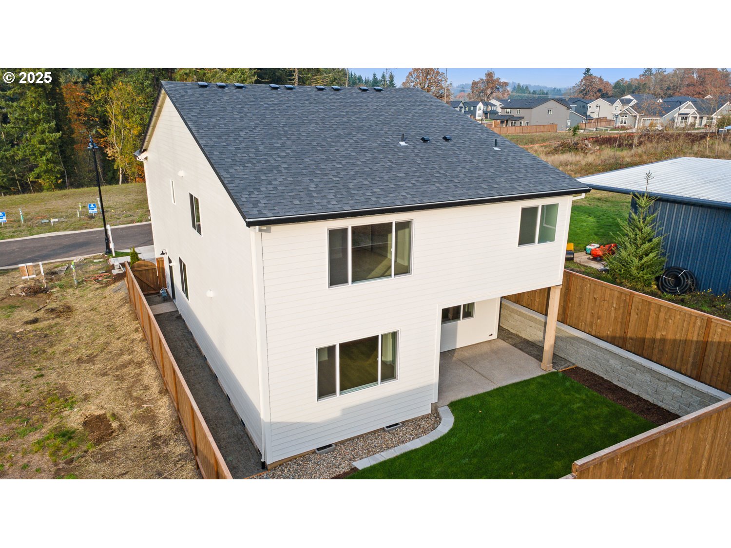 7212 Southwest Windflower Street Wilsonville, OR 97070 - Photo 27 of 28 a backyard of a house with wooden floor and fence