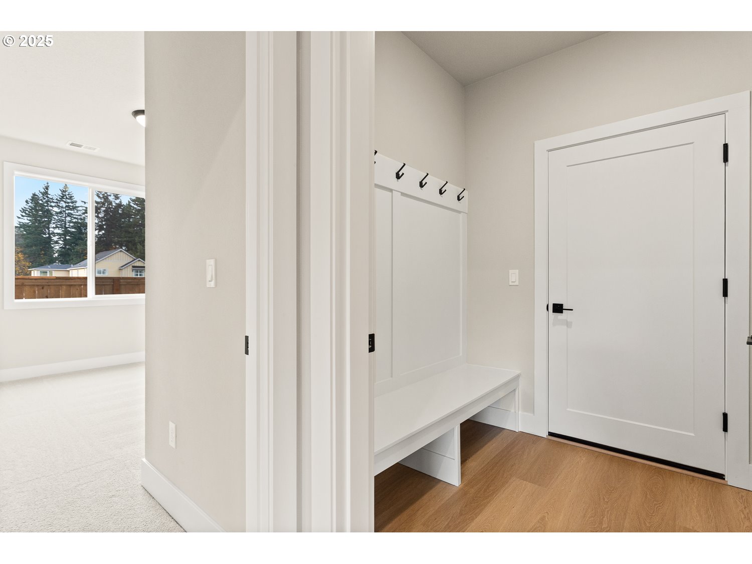 7212 Southwest Windflower Street Wilsonville, OR 97070 - Photo 7 of 28 a view of an empty room with wooden floor and a window