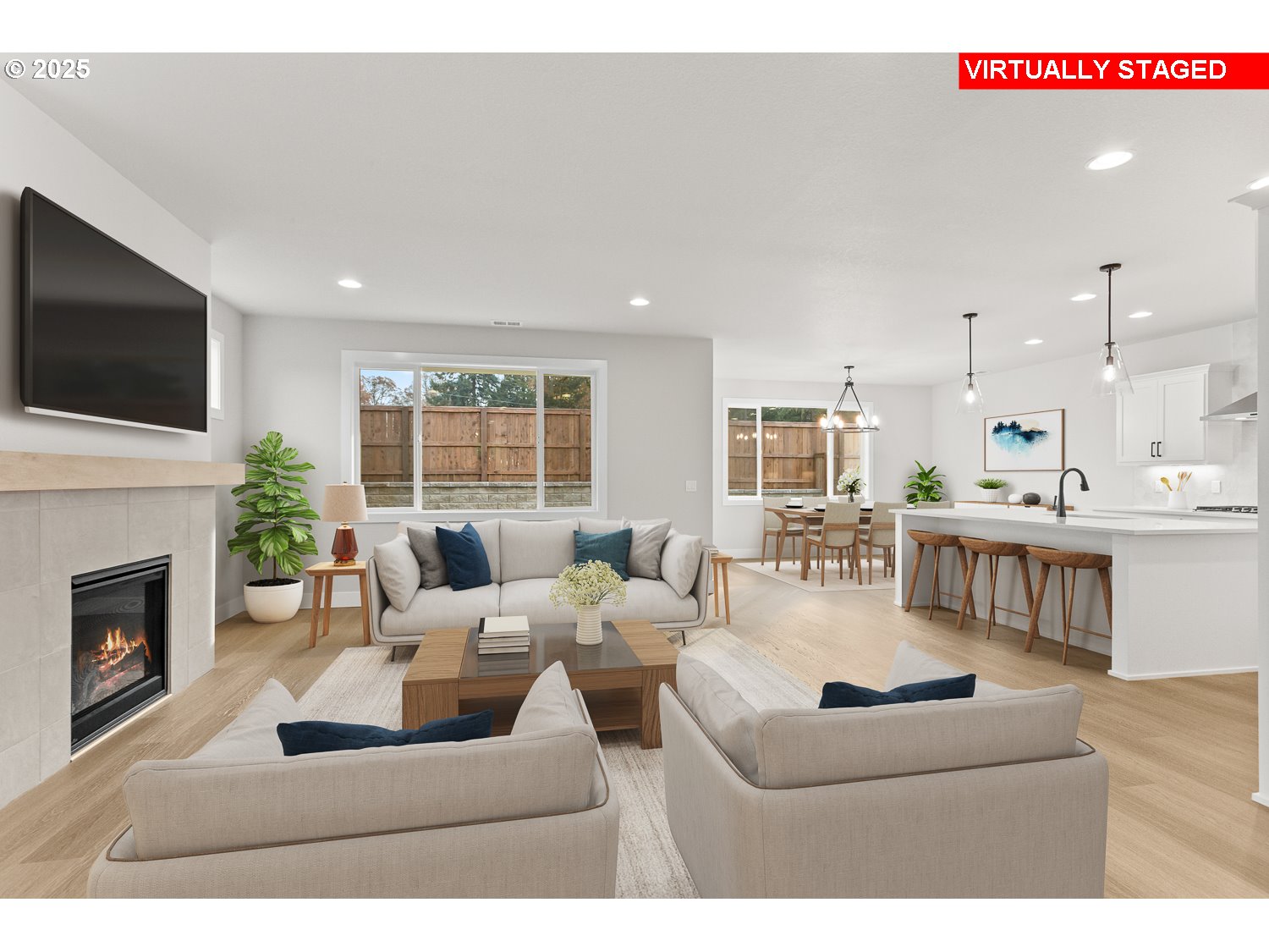 7212 Southwest Windflower Street Wilsonville, OR 97070 - Photo 9 of 28 a living room with fireplace furniture and a flat screen tv
