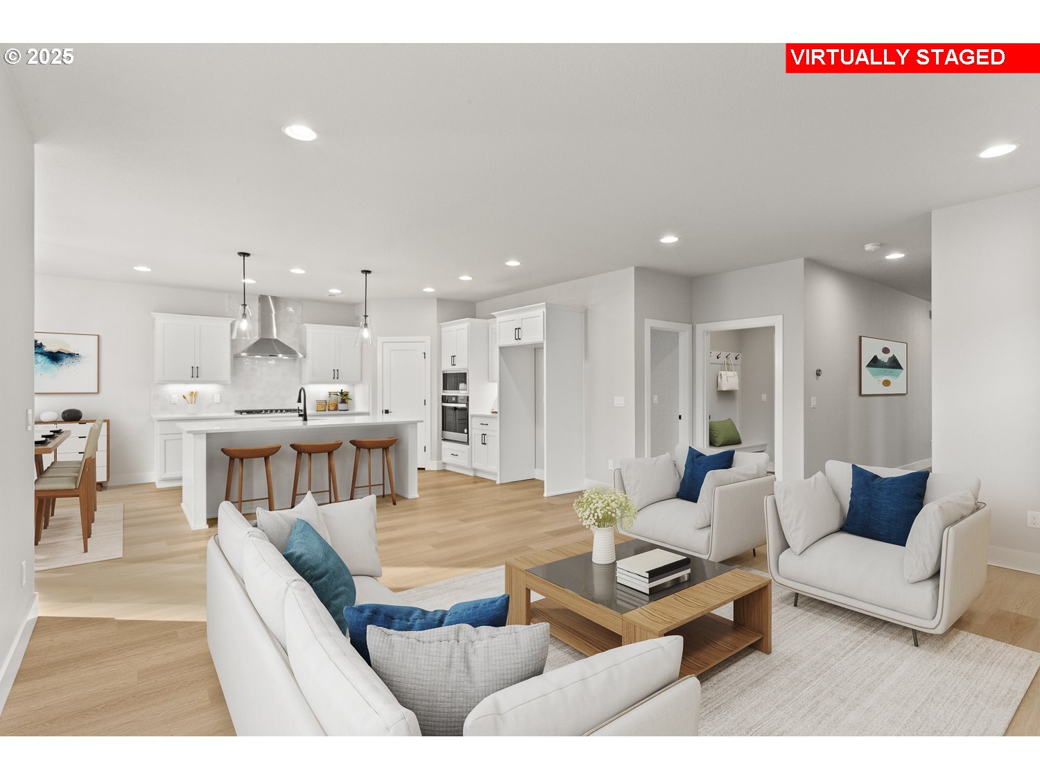 7212 Southwest Windflower Street Wilsonville, OR 97070 - Photo 10 of 28 a living room with kitchen view and a dining table with kitchen view