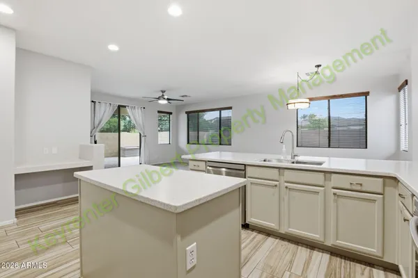 a kitchen with cabinets stainless steel appliances and a sink