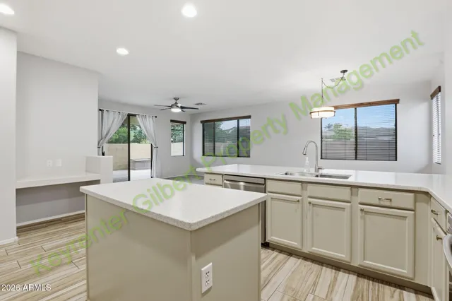 a kitchen with cabinets stainless steel appliances and a sink