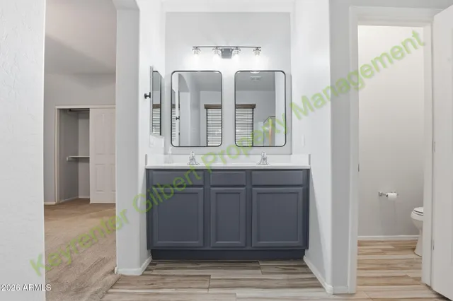 a view of an empty room with a ceiling fan