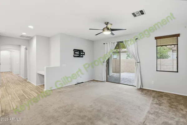 a front view of a house with a garden and patio
