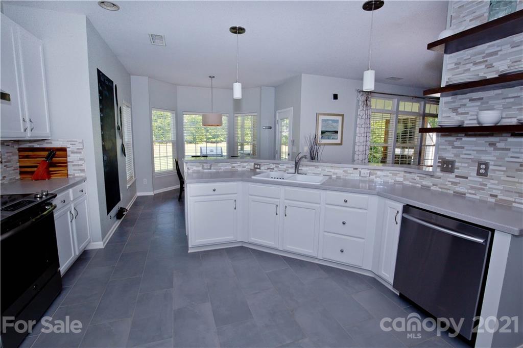 20200 Tailwind Lane Cornelius, NC 28031 - Photo 12 of 28 a large kitchen with cabinets