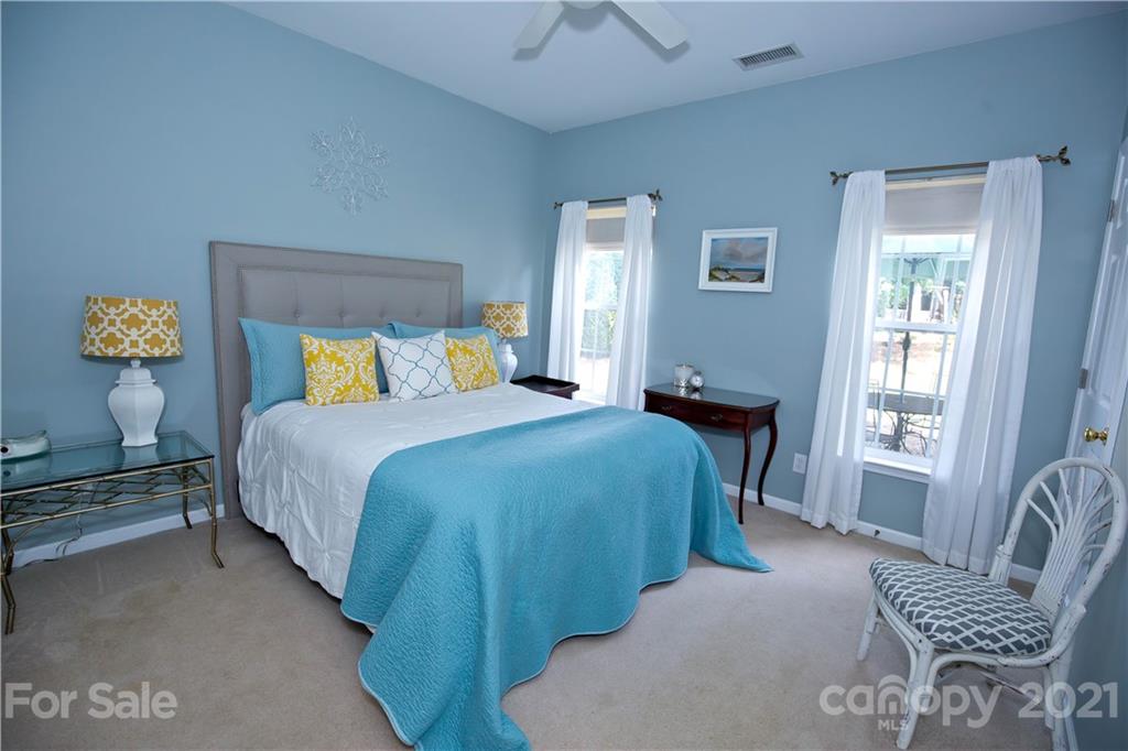 20200 Tailwind Lane Cornelius, NC 28031 - Photo 14 of 28 a bedroom with a bed and window