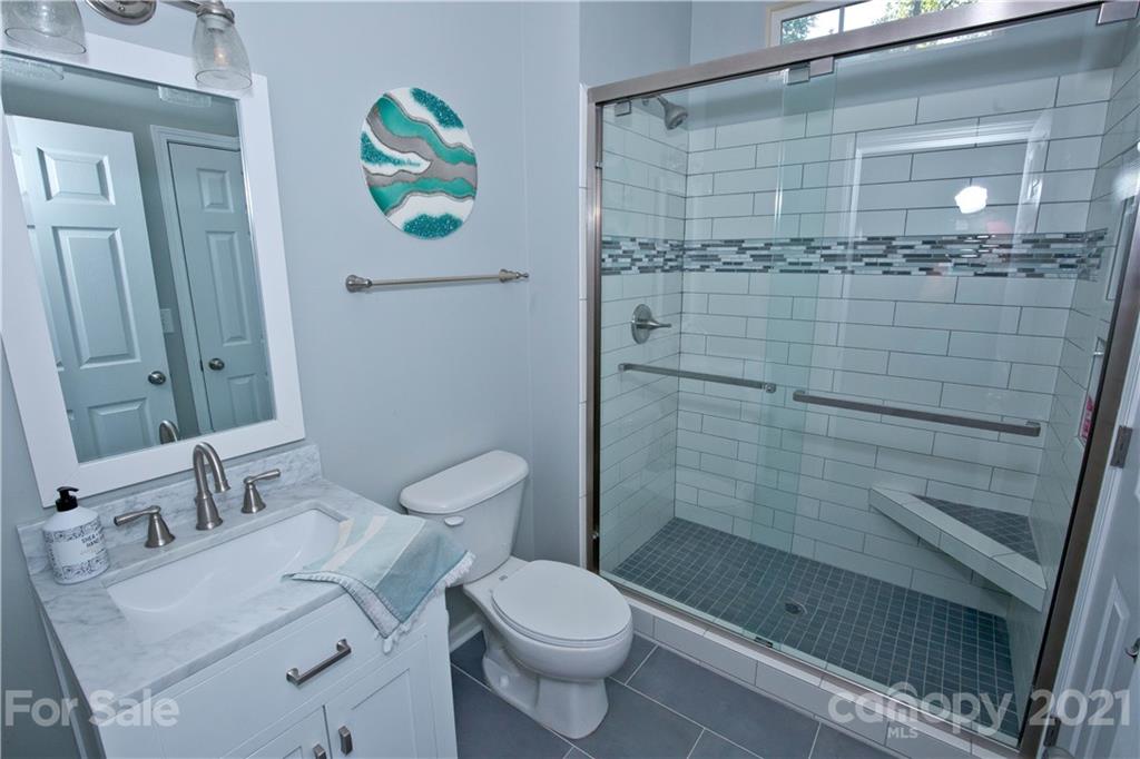 20200 Tailwind Lane Cornelius, NC 28031 - Photo 15 of 28 a bathroom with a sink toilet and shower