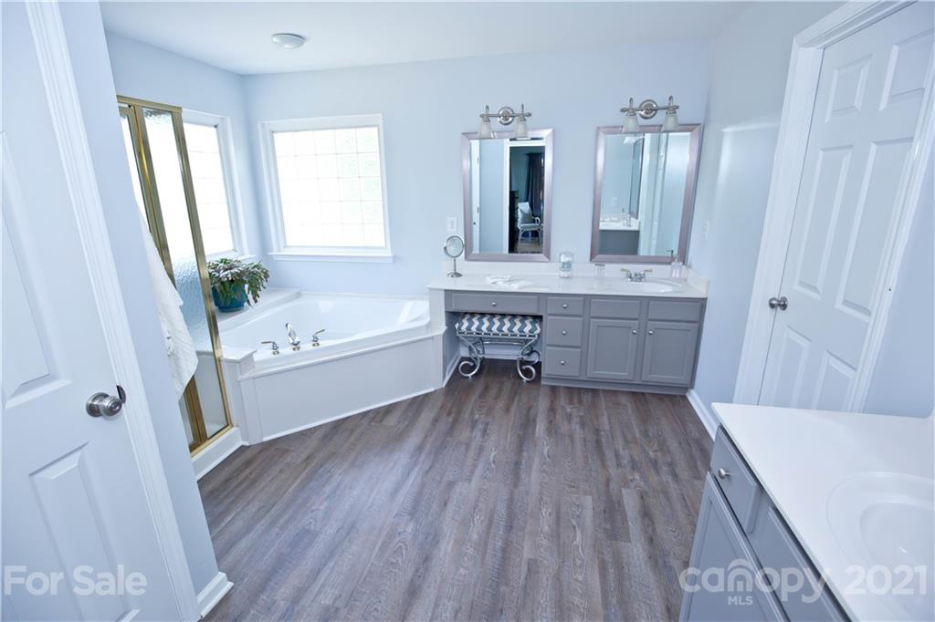 20200 Tailwind Lane Cornelius, NC 28031 - Photo 17 of 28 a bathroom with a sink and a bathtub