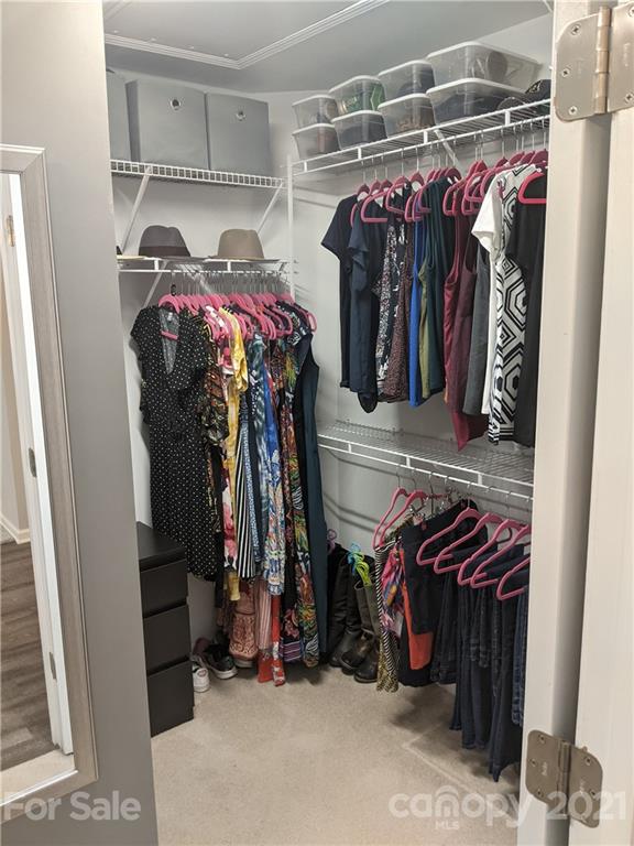 20200 Tailwind Lane Cornelius, NC 28031 - Photo 18 of 28 a view of walk in closet with clothes