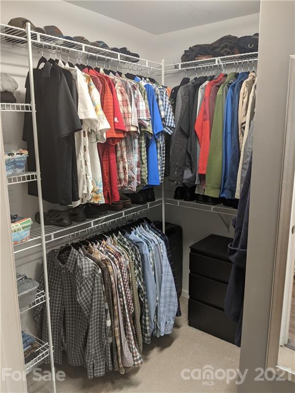 20200 Tailwind Lane Cornelius, NC 28031 - Photo 19 of 28 a view of walk in closet with clothes