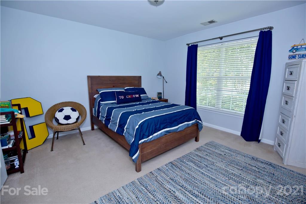 20200 Tailwind Lane Cornelius, NC 28031 - Photo 20 of 28 a bedroom with a bed and a window