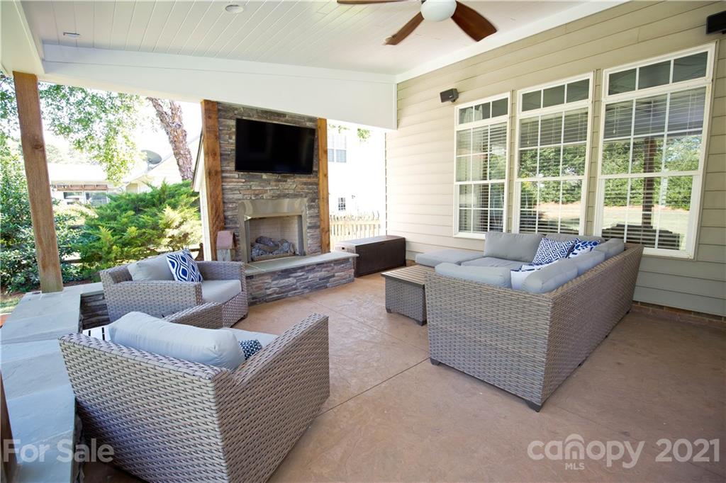 20200 Tailwind Lane Cornelius, NC 28031 - Photo 8 of 28 a living room with furniture and a fireplace