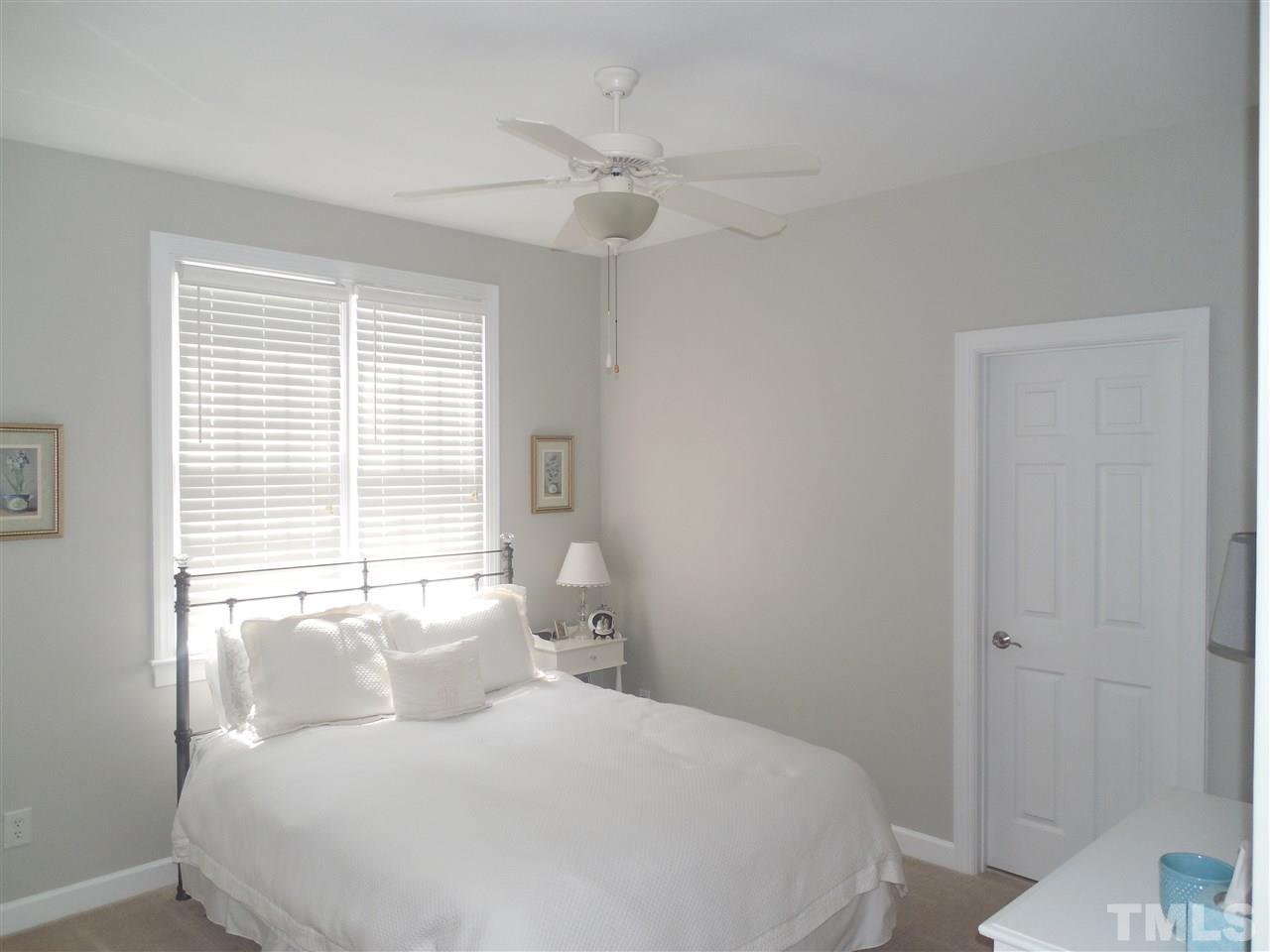 1618 Weatherford Circle Raleigh, NC 27604 - Photo 12 of 20 a bedroom with a large bed and a large window