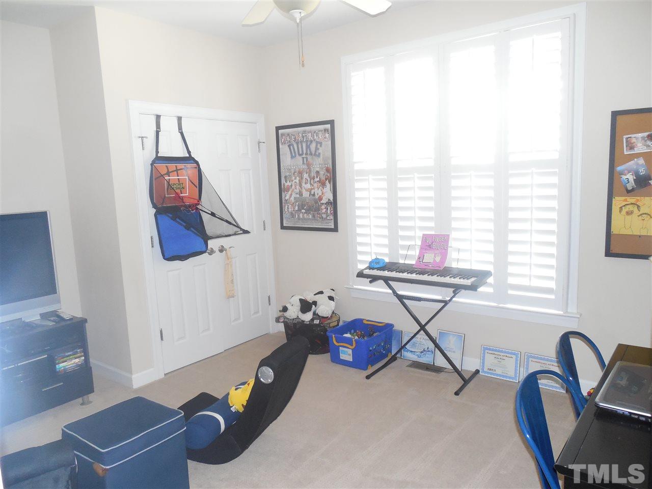 1618 Weatherford Circle Raleigh, NC 27604 - Photo 14 of 20 a living room with furniture and a window
