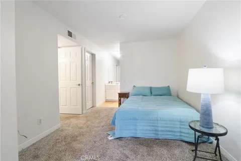 a room with a bed and a lamp