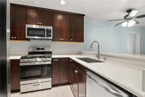 a kitchen with a stove and a microwave