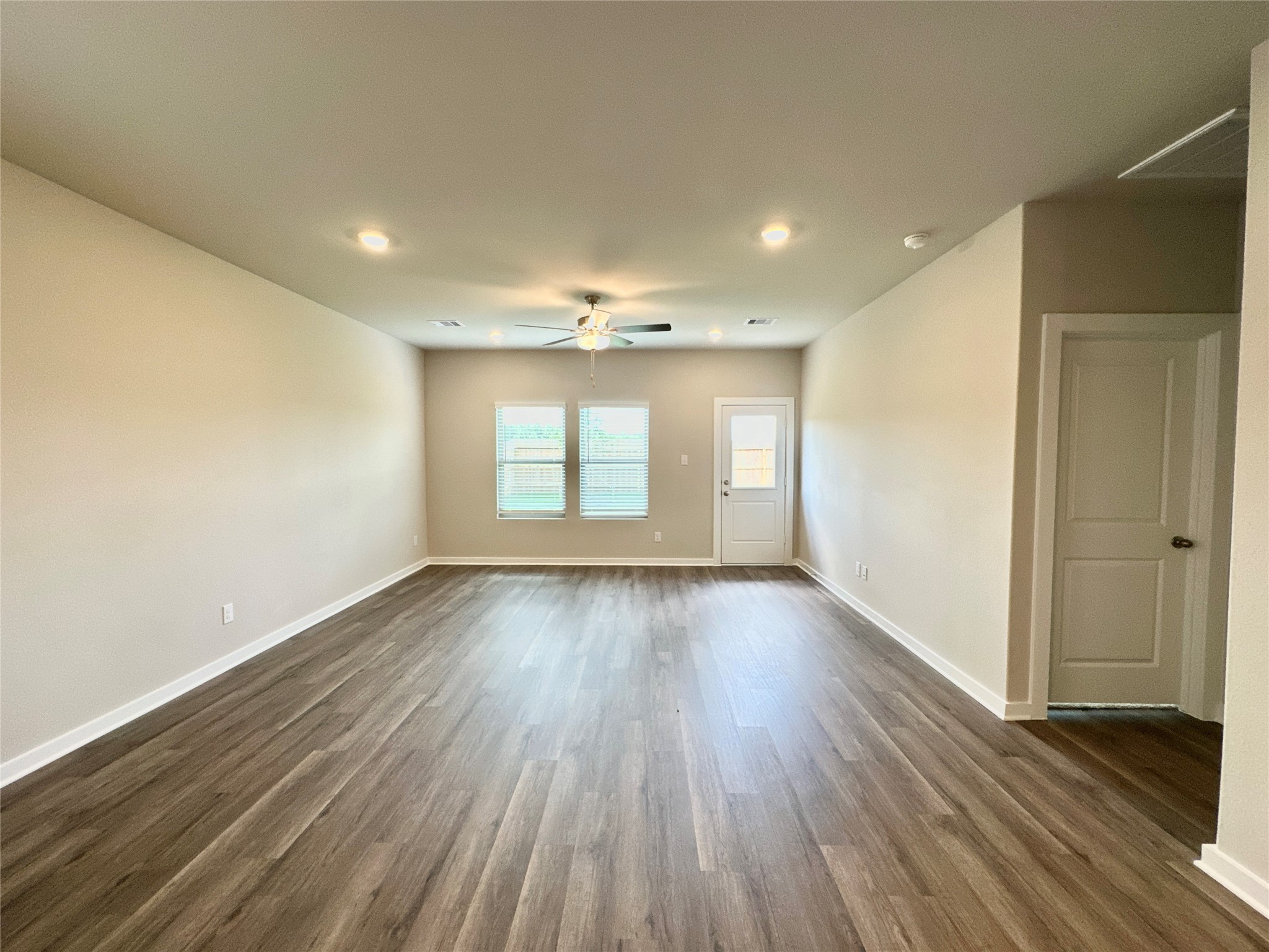 12164 Ridge Top Drive Conroe, TX 77304 - Photo 6 of 23 an empty room with wooden floor and windows