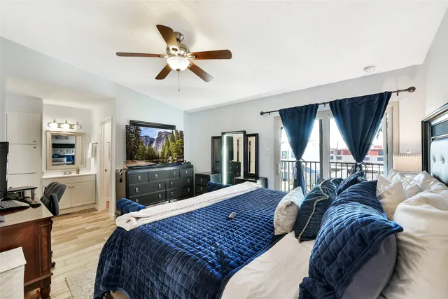 a bedroom with a bed and glass window