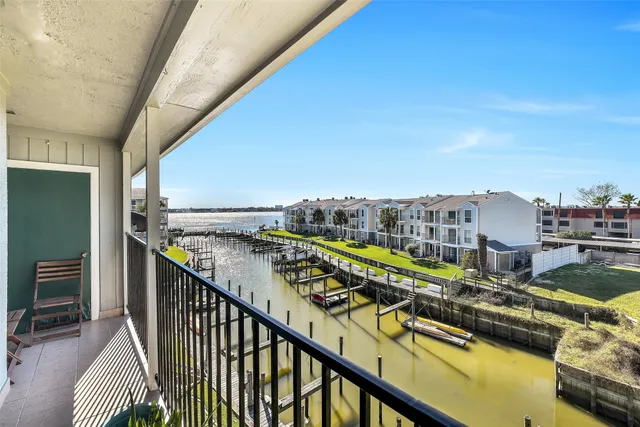 a view of swimming pool from a balcony