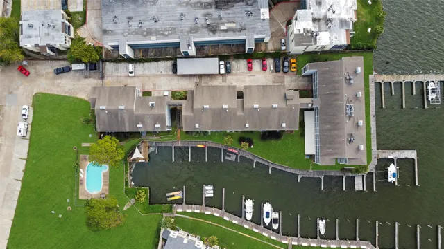 a view of a cars park in front of a building