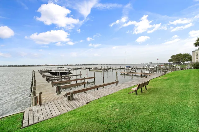 a view of a lake with a city skyline in the background