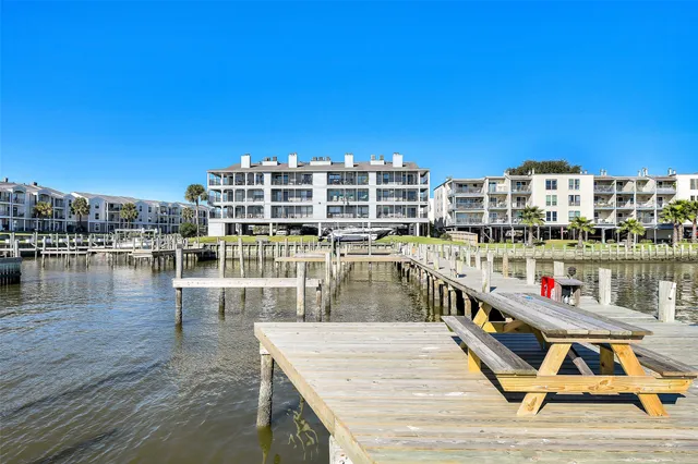 an aerial view of a house with outdoor space and lake view
