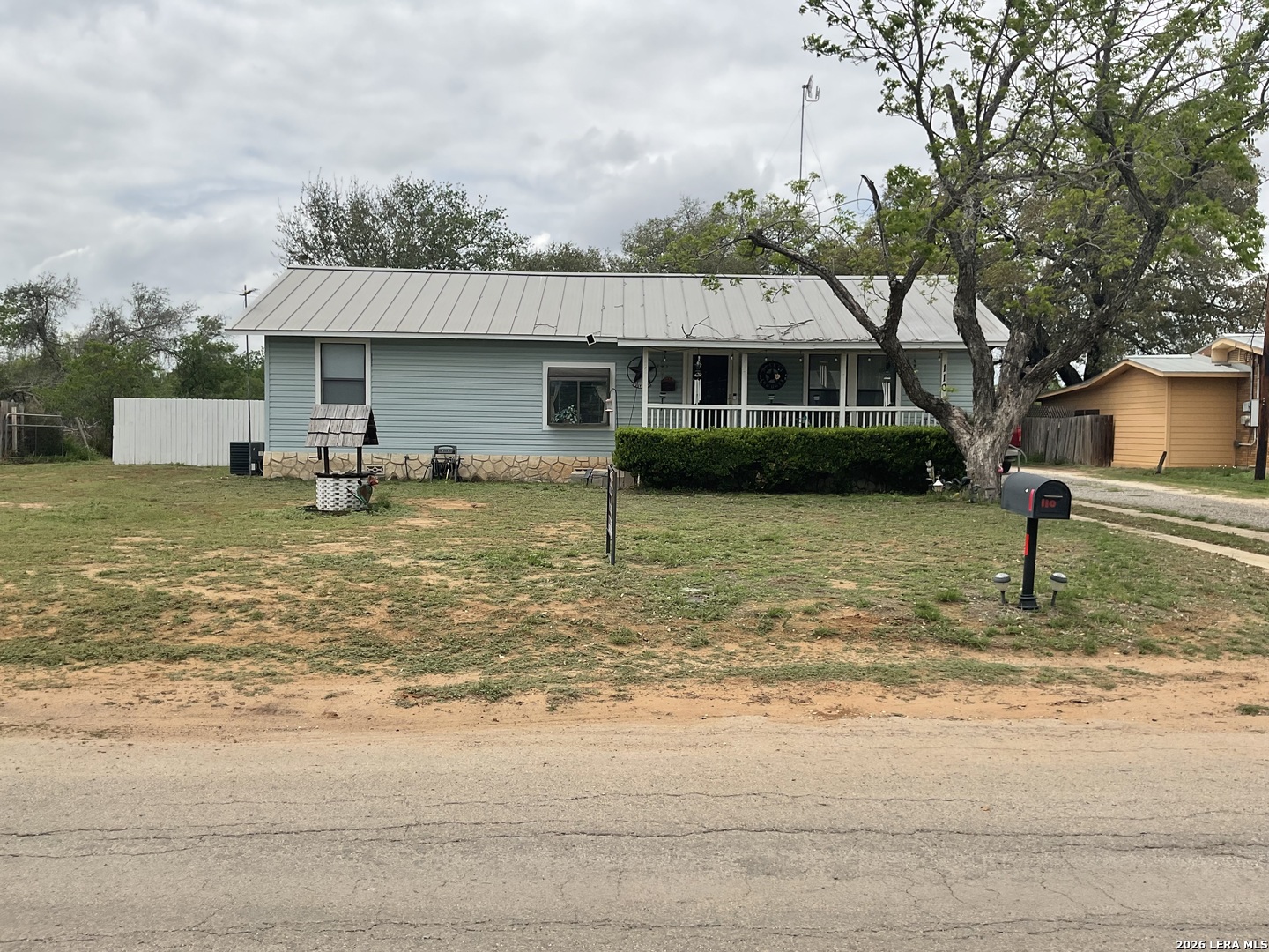 110 Renfro Drive Devine, TX 78016 - Photo 2 of 17 a front view of a house with garden