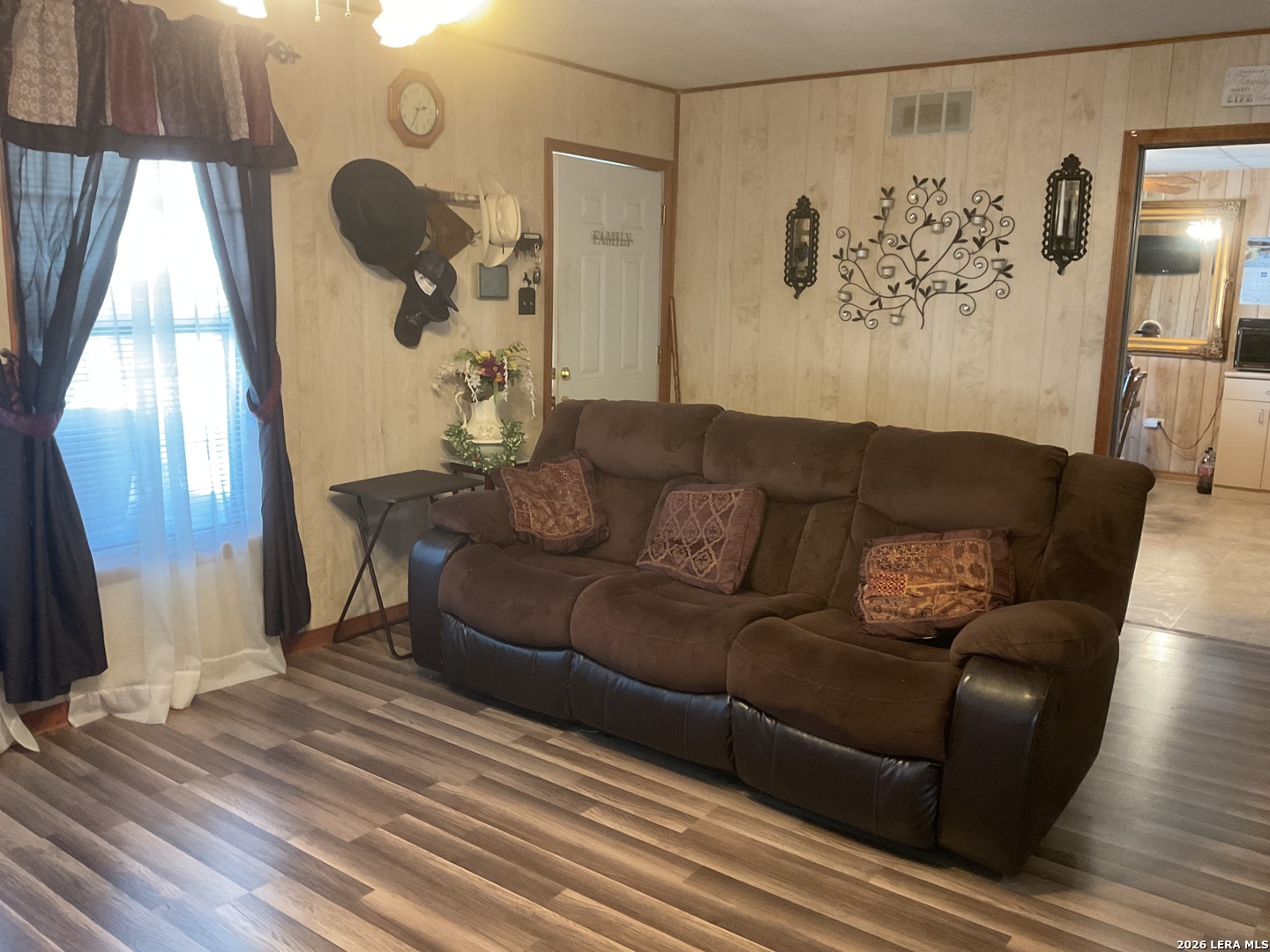 110 Renfro Drive Devine, TX 78016 - Photo 6 of 17 a living room with furniture and wooden floor