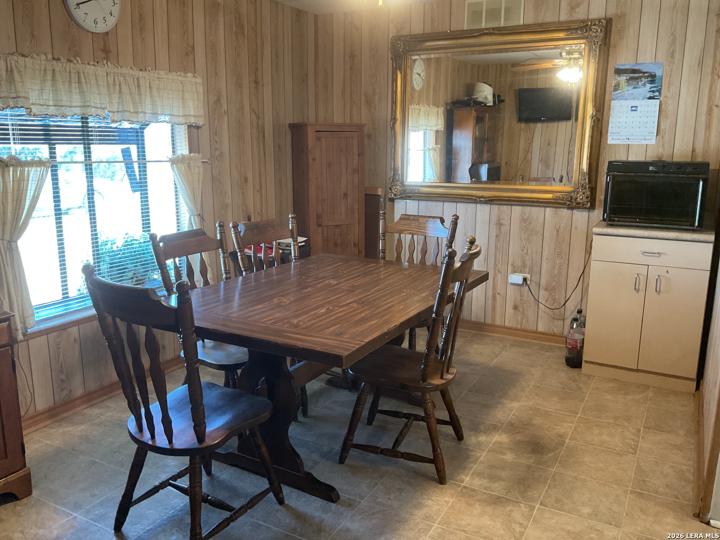 110 Renfro Drive Devine, TX 78016 - Photo 7 of 17 a view of a dining room with furniture and window