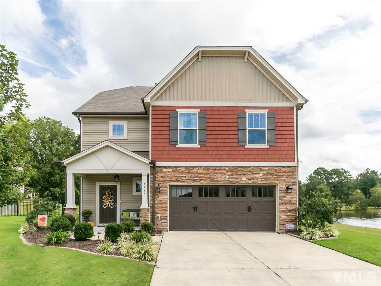7726 Cedarshire Court Raleigh, NC 27616 - Photo 1 of 28 a front view of a house with a yard
