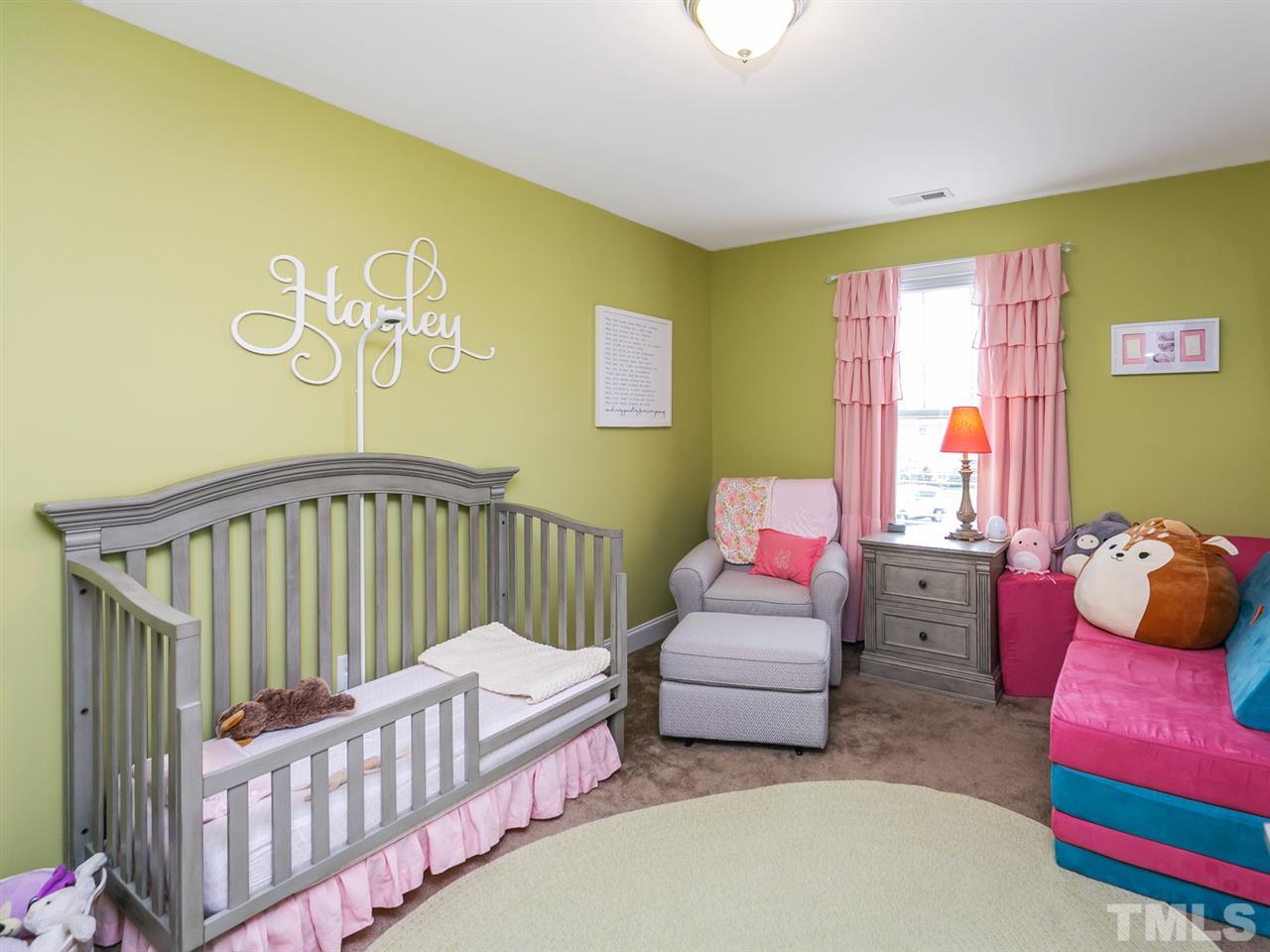 7726 Cedarshire Court Raleigh, NC 27616 - Photo 15 of 28 a bedroom with furniture and a window
