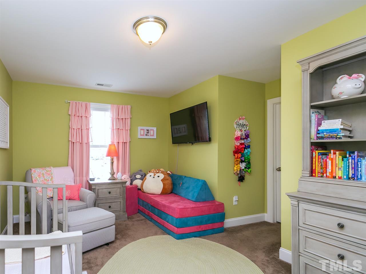 7726 Cedarshire Court Raleigh, NC 27616 - Photo 16 of 28 a living room with furniture and a flat screen tv
