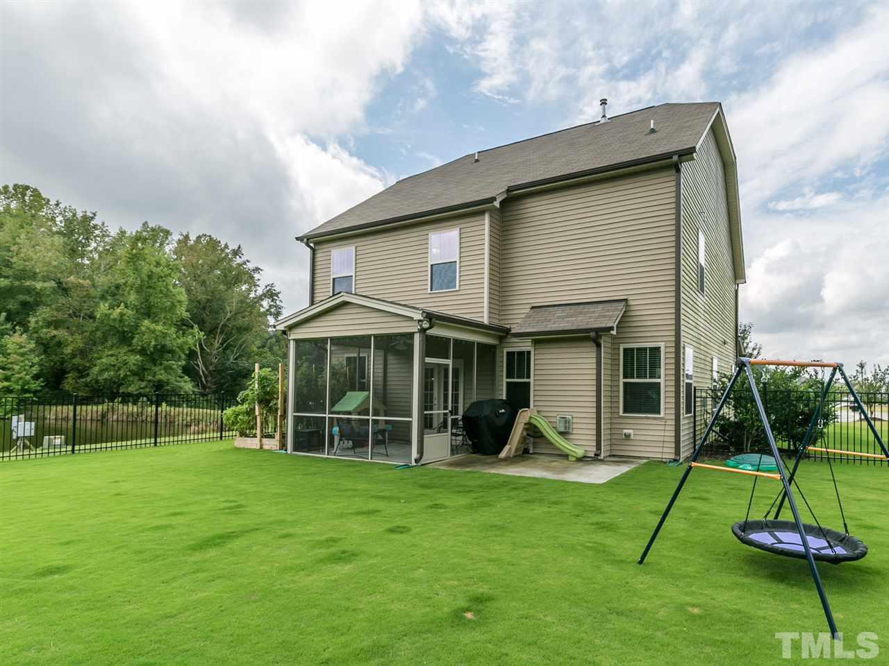 7726 Cedarshire Court Raleigh, NC 27616 - Photo 27 of 28 a view of a house with backyard