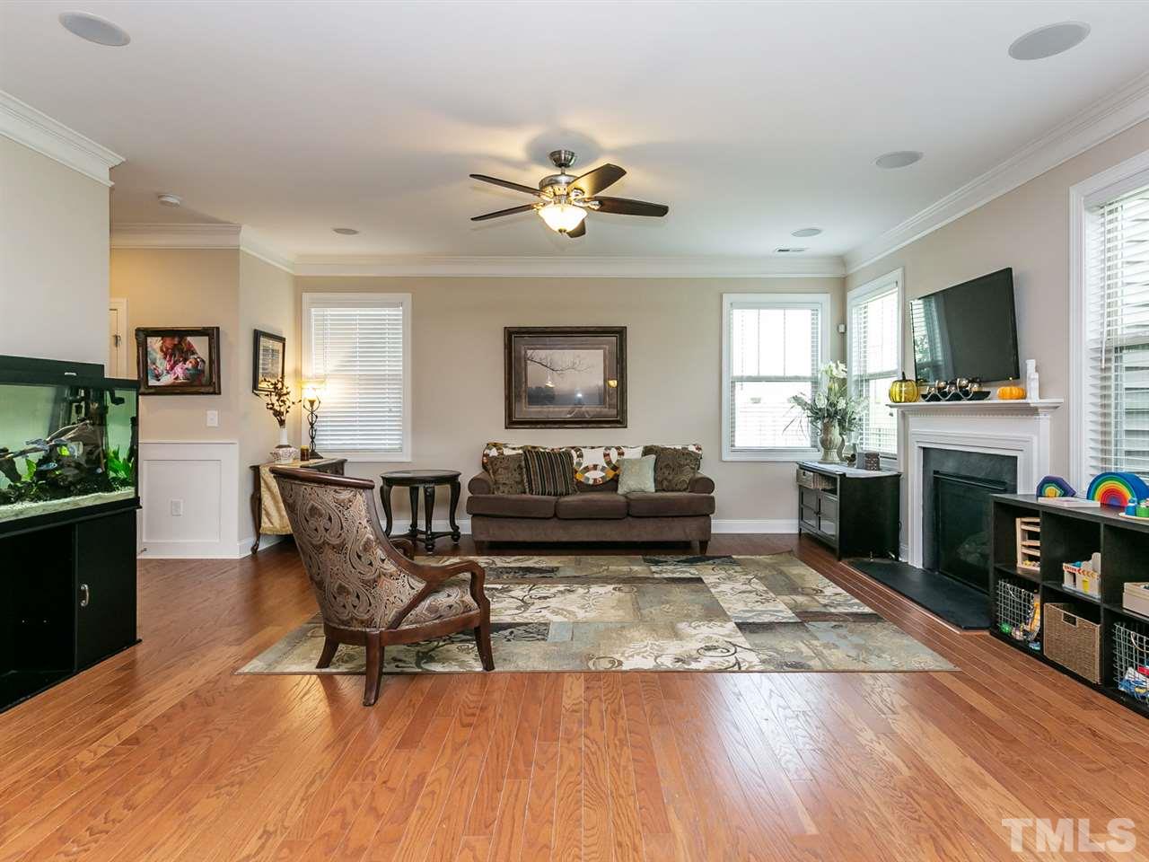 7726 Cedarshire Court Raleigh, NC 27616 - Photo 5 of 28 a living room with furniture and a flat screen tv
