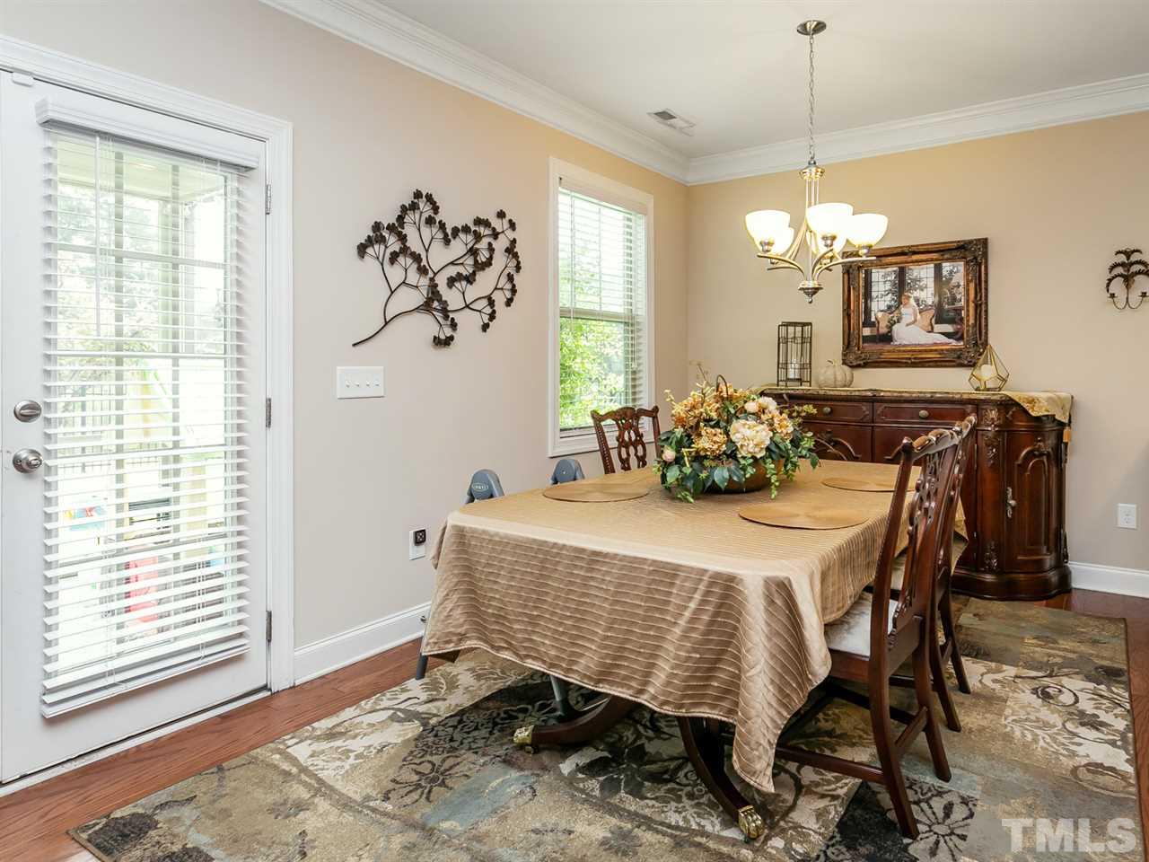 7726 Cedarshire Court Raleigh, NC 27616 - Photo 7 of 28 a dining room with furniture and window