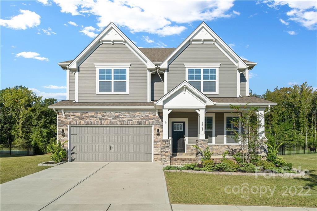 a view of house with yard