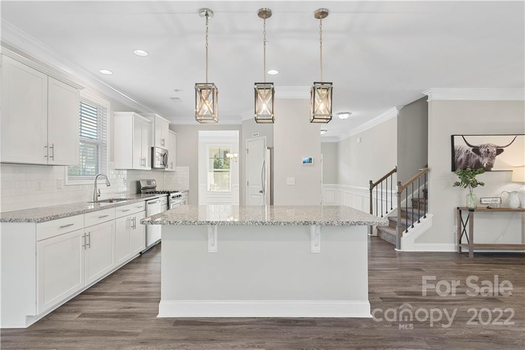 4025 Shadowbrook Road Waxhaw, NC 28173 - Photo 11 of 48 a large white kitchen with kitchen island